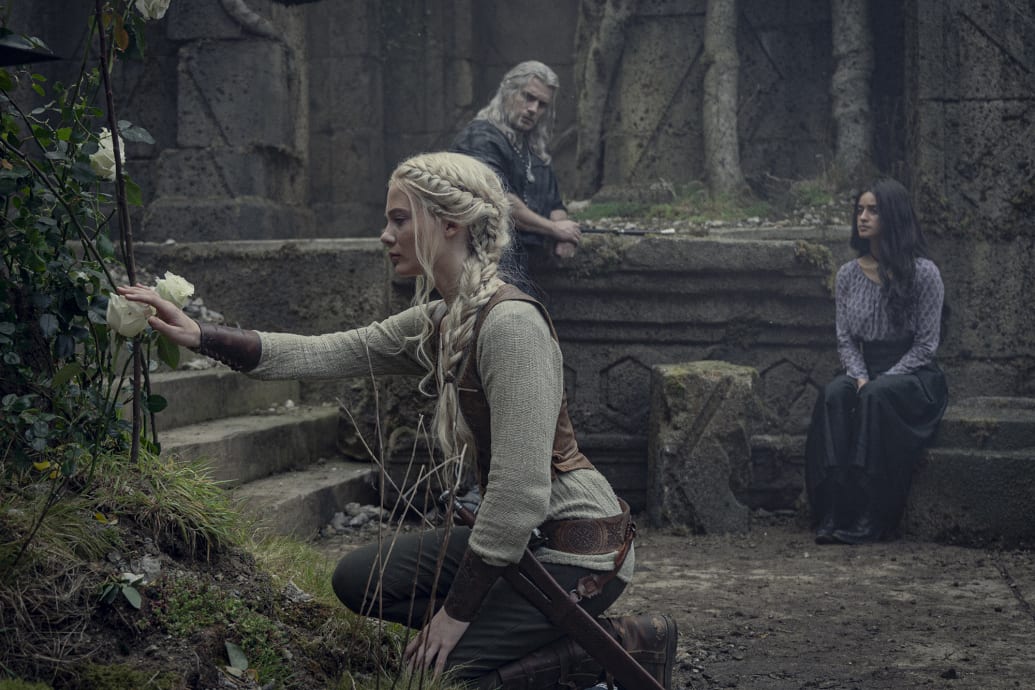 A photo still of Freya Allan, Henry Cavill, and Anya Chalotra from The Witcher.