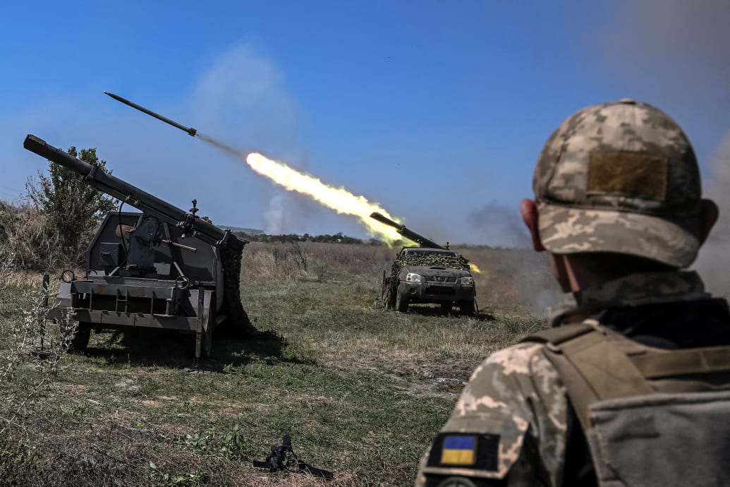 Ukrainian servicemen fire small multiple launch rocket systems towards Russian troops.