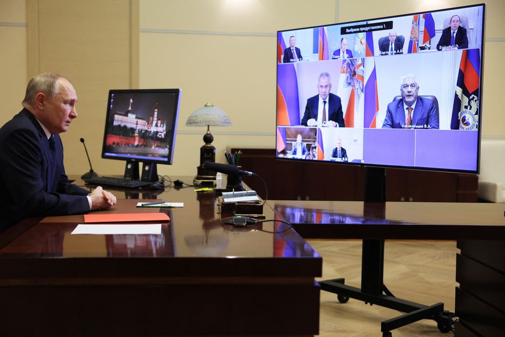 Russian President Vladimir Putin chairs a meeting with members of the Security Council.