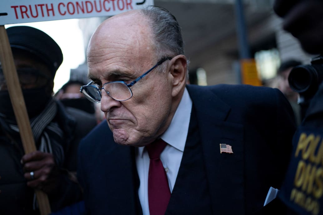 Former New York Mayor Rudy Giuliani departs the U.S. District Courthouse.