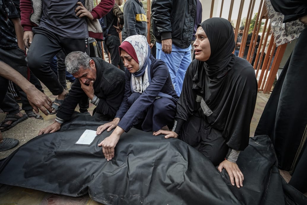 Relatives of the Palestinians killed in Israeli attacks mourn at Nasser Hospital in Khan Yunis, Gaza.