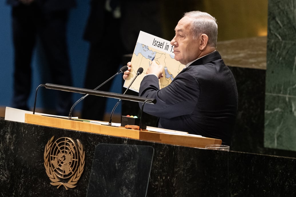 Prime Minister of Israel Benjamin Netanyahu holds up a map of Israel at the 78th Session of the General Assembly of the UN.