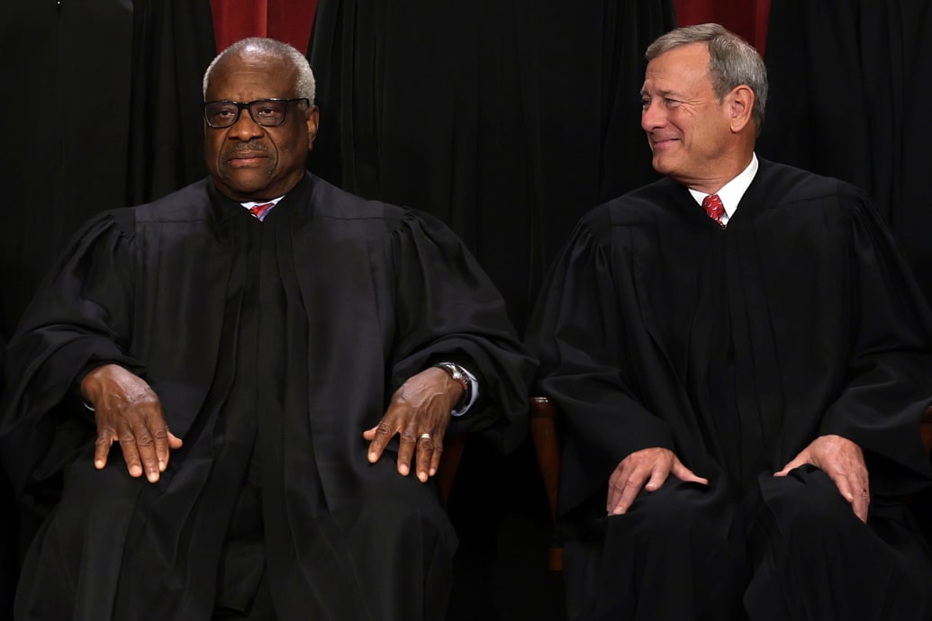 Supreme Court Associate Justice Clarence Thomas and Chief Justice of the United States John Roberts.