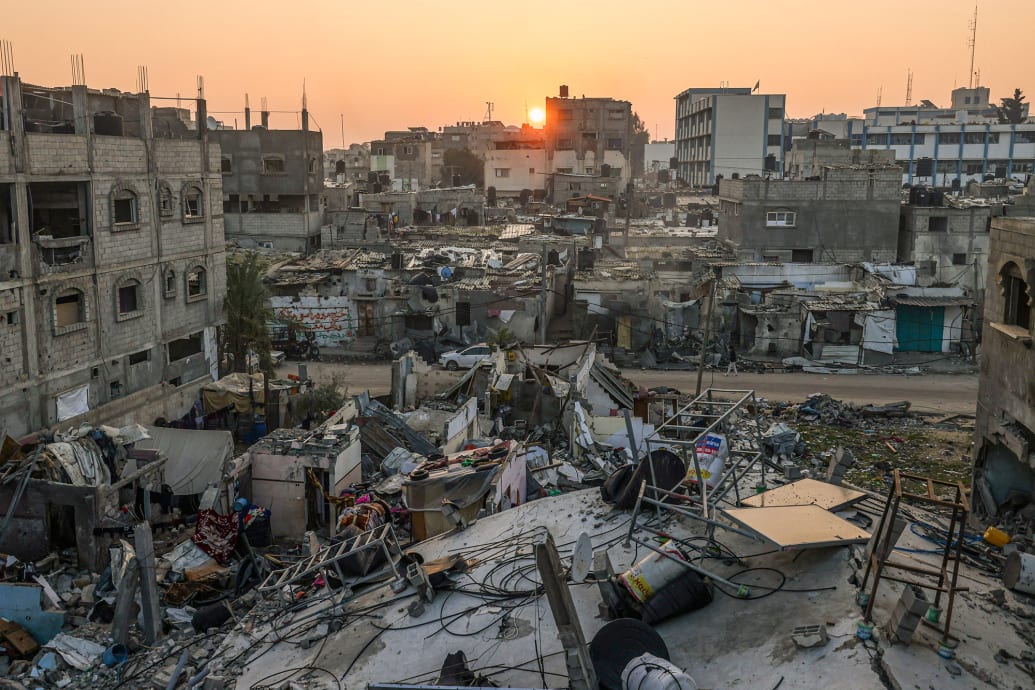 The sun rises above the Rafah refugee camp in southern Gaza.