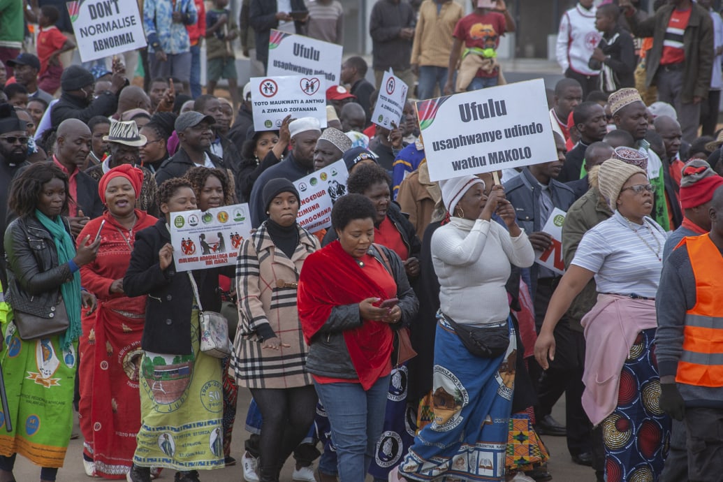 Protesters carry placards during a national wide march organized by churches in Malawi.