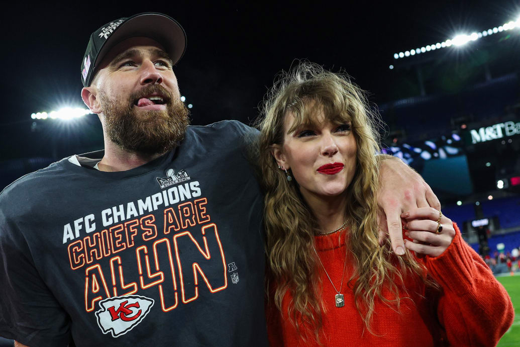 Travis Kelce of the Kansas City Chiefs celebrates with Taylor Swift.