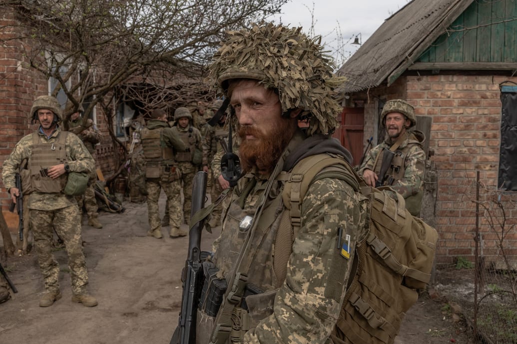 Ukrainian infantry soldiers of the 23rd Mechanized Brigade wait to head toward the frontline.