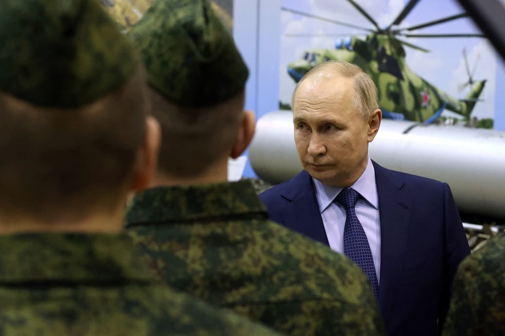 Russian President Vladimir Putin talks to military pilots in Torzhok.