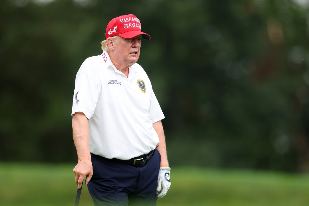 Former President Donald Trump looks on during the pro-am prior to the LIV Golf Invitational.