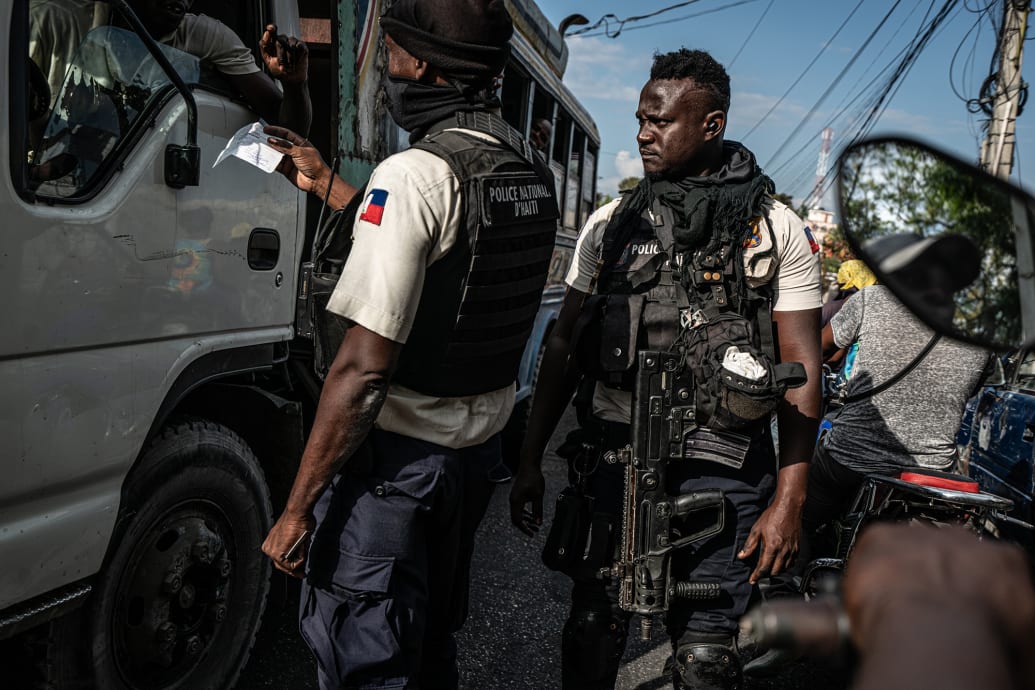 Haitian National Police check the papers of vehicles and drivers in Port-au-Prince, Haiti.