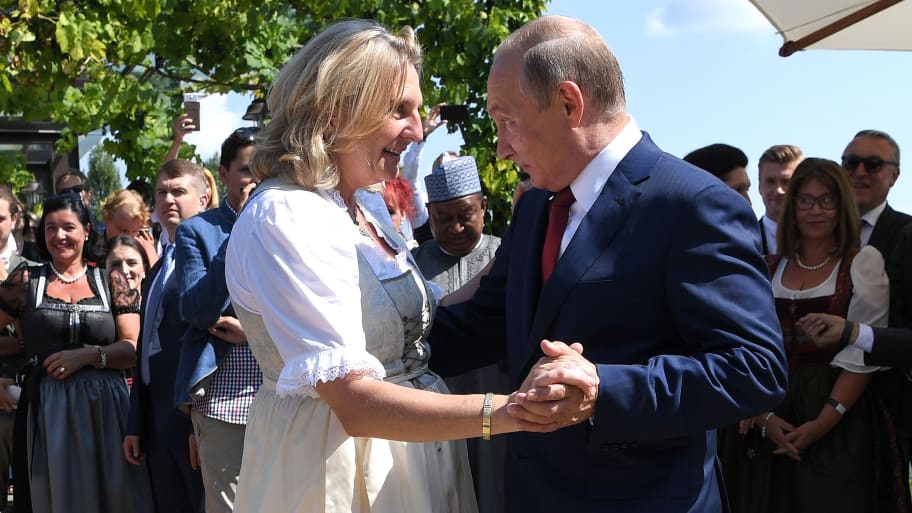 Austria's then-Foreign Minister Karin Kneissl dances with Russia's President Vladimir Putin at her wedding in Gamlitz, Austria, August 18, 2018. 