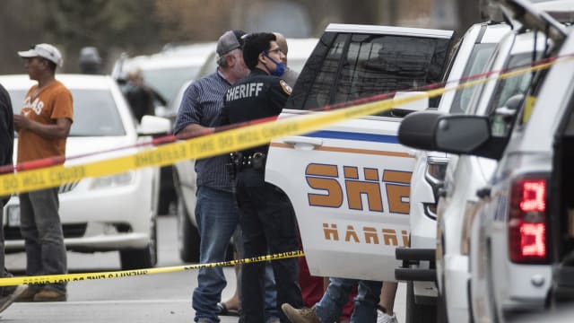 Sheriff's investigators investigate the scene where two men were shot to death in northeast Harris County Wednesday, March 10, 2021 in Houston. 