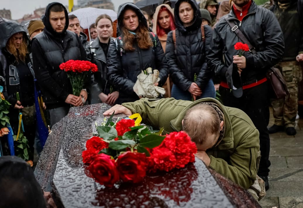 People pay tribute to Ukrainian serviceman Nazarii Lavrovskyi.