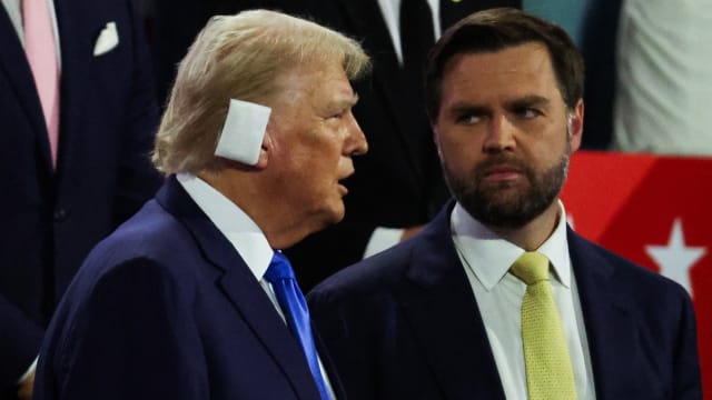 J.D. Vance stands next to Donald Trump at the GOP convention in Milwaukee