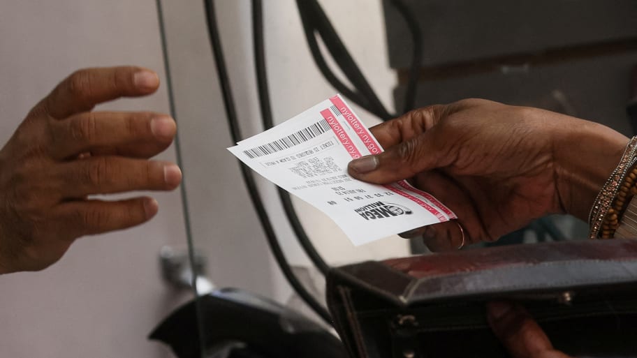 A customer purchases Mega Millions and Powerball tickets in New York City.