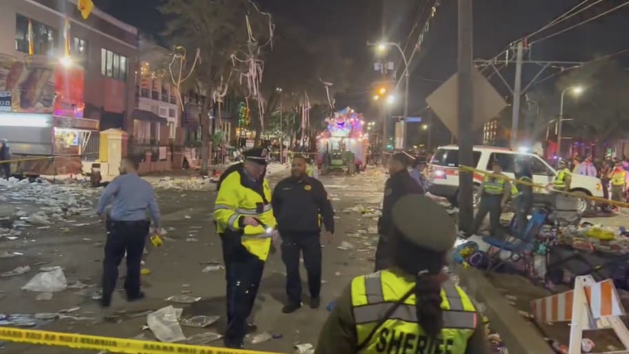 The scene following a shooting on the Krewe of Bacchus parade route.