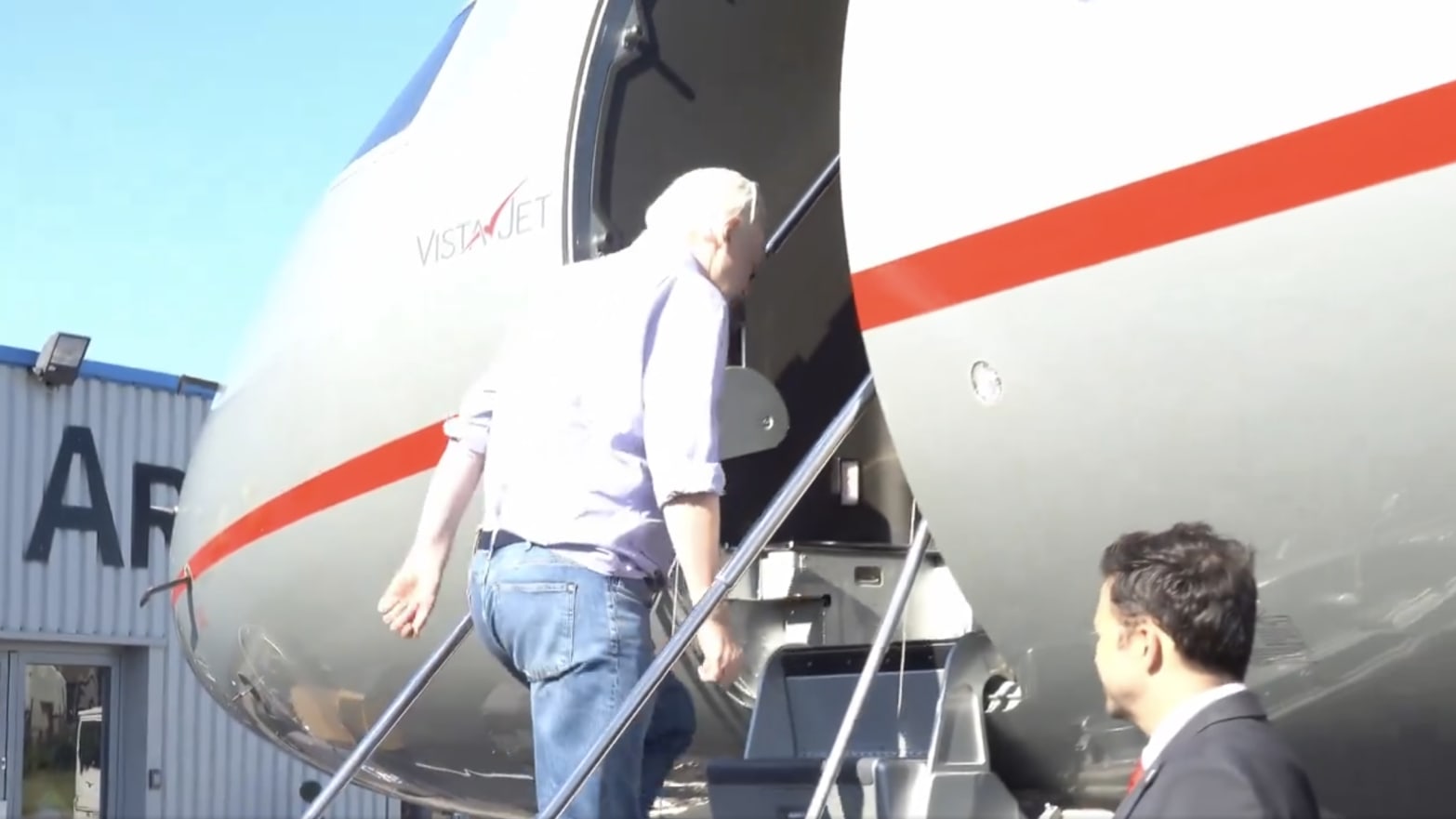 Julian Assange boarding a plane and departing the U.K. after striking a deal with U.S. prosecutors.