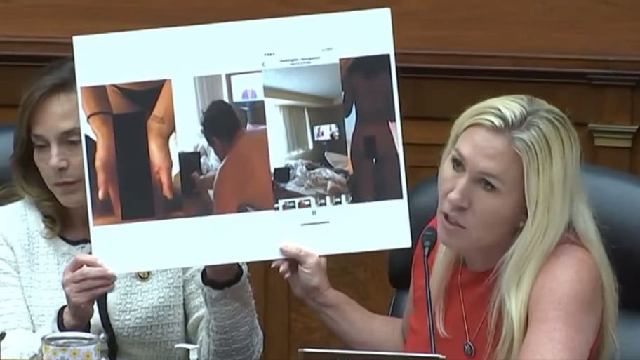  Rep. Marjorie Taylor Greene showing several blown-up nude images of Hunter Biden. 