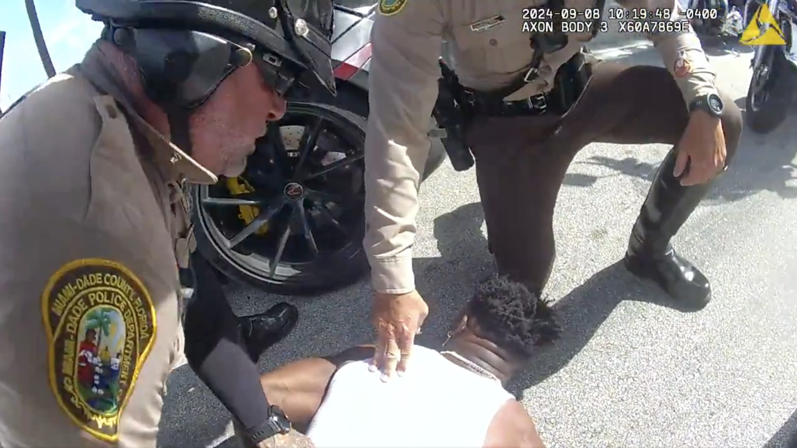 Tyreek Hill being arrested by Miami-Dade police officers.