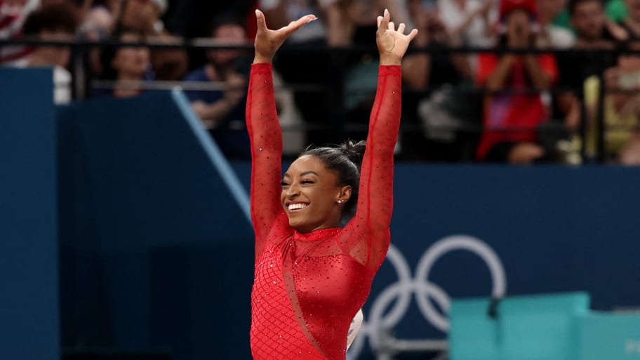 Simone Biles of United States reacts after performing at Paris Olympics.