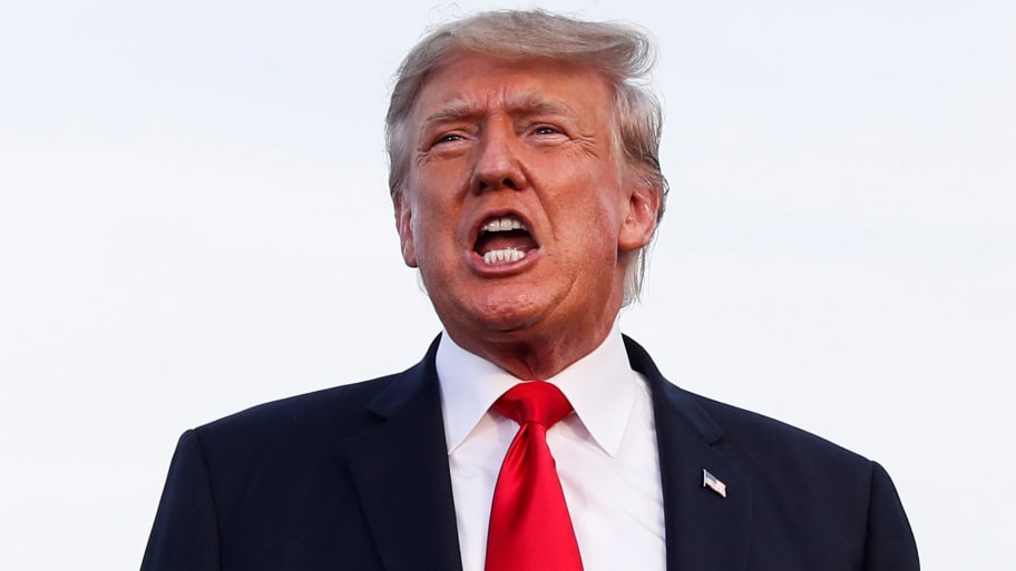 President Donald Trump reacts during his first post-presidency campaign rally at the Lorain County Fairgrounds in Wellington, Ohio, June 26, 2021. 