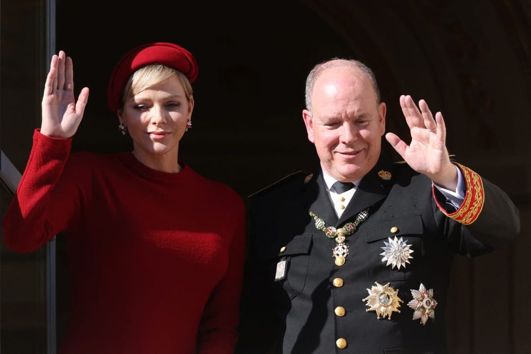 Prince Albert II of Monaco and Princess Charlene wave as they stand on the Palace balcony during the celebrations marking Monaco's National Day in Monaco, November 19, 2023.