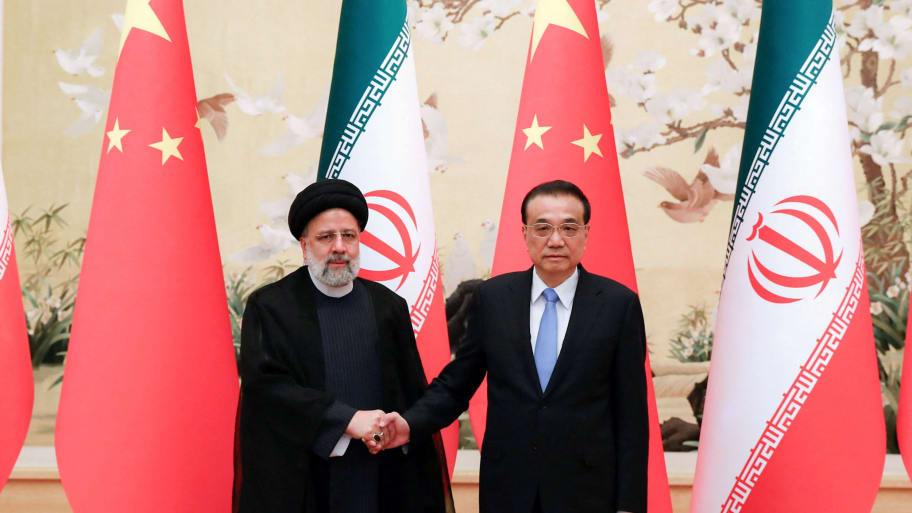 China's Vice President Wang Qishan meets with Iran's President Ebrahim Raisi in Beijing, China, February 14, 2023.