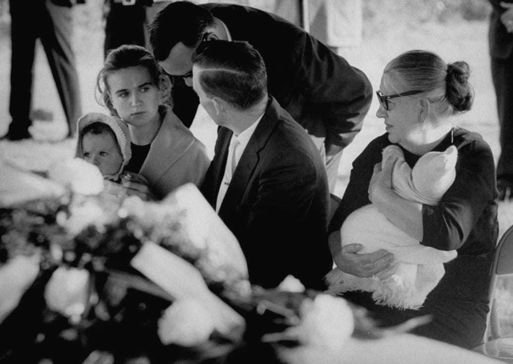 Marina Oswald Porter, wife of Lee Harvey Oswald, (L) Marguerite Oswald (R), mother of Oswald, and brother Robert L. Oswald (center), attending the funeral of Lee Harvey Oswald.