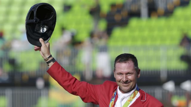 Eric Lamaze (CAN) of Canada celebrates his bronze medal in 2016