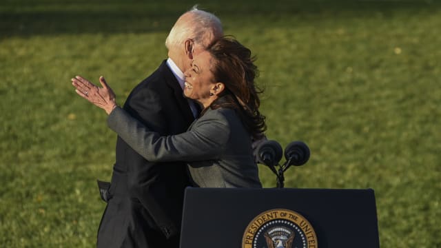 U.S. Vice President Kamala Harris hugs President Joe Biden on the South Lawn at the White House.