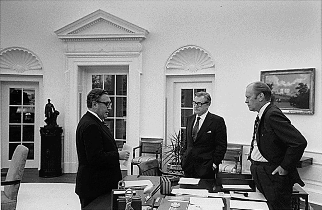 President Gerald Ford, then-Secretary of State Henry Kissinger, and Vice President Nelson Rockefeller discuss the evacuation of Saigon, on April 28,1975, at the White House.