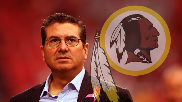 Image of Dan Snyder with Redskins mascot log behind him.