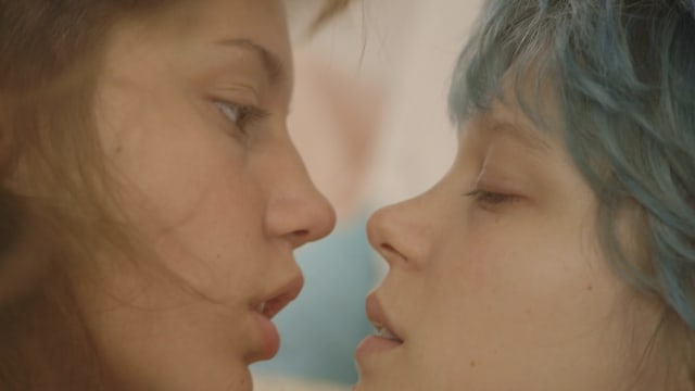 A love scene between Adèle (Adèle Exarchopoulos), a 15-year-old high school student and Emma (Léa Seydoux), an art student at a nearby college with a flashy blue ’do.