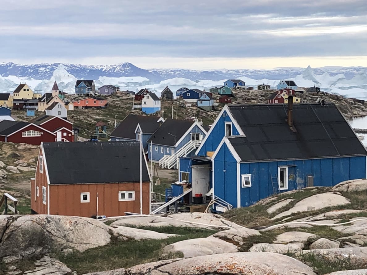 Colorful clapboard houses near the shore in Saqqaq, Greenland.