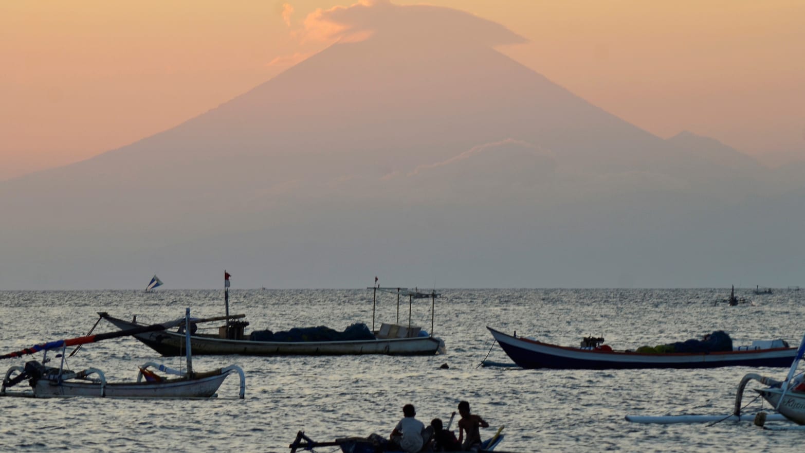Tremors from Mount Agung have led Indonesian scientists to believe it may erupt for the first time in more than 50 years, forcing residents out amid heightened travel warnings.