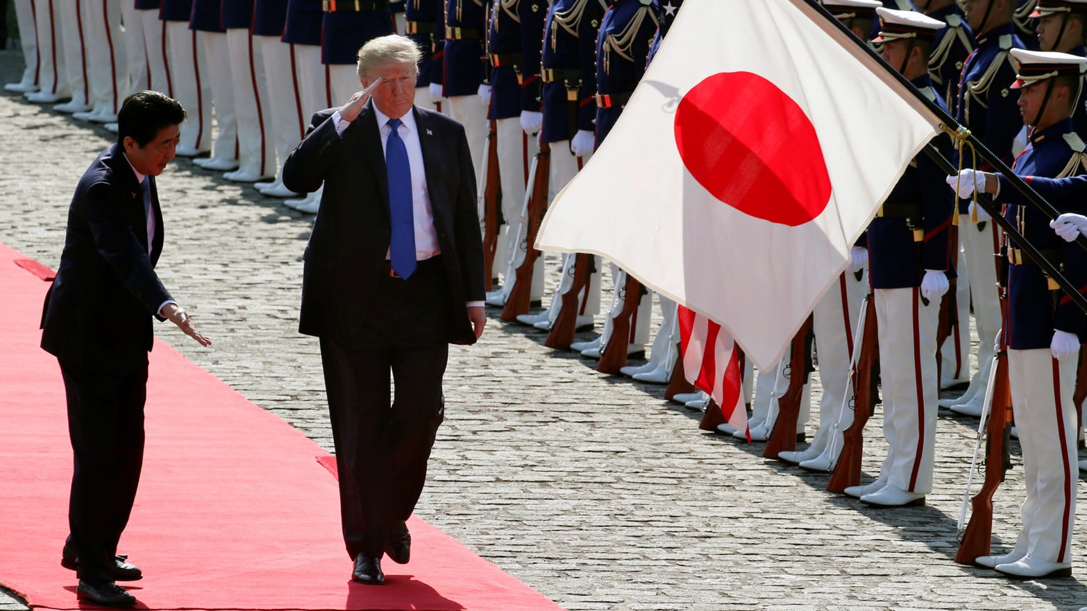 U.S. President Donald Trump reviews an honor guard during a welcome ceremony with Japanese Prime Minister Shinzo Abe at Akasaka State Guest House in Tokyo, Monday, Nov.6, 2017.