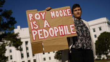 Rose Falvey protests across the street from a ‘Women for Moore’ rally in support of Republican candidate for U.S. Senate Judge Roy Moore, in front of the Alabama State Capitol, Nov. 17, 2017, in Montgomery, Alabama.