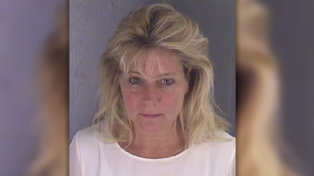 Teresa Jo Burchfield, wife of a lawyer in charge of overseeing ethics in President Trump’s business trust was arrested outside a Virginia jail—with an inmate in her backseat.