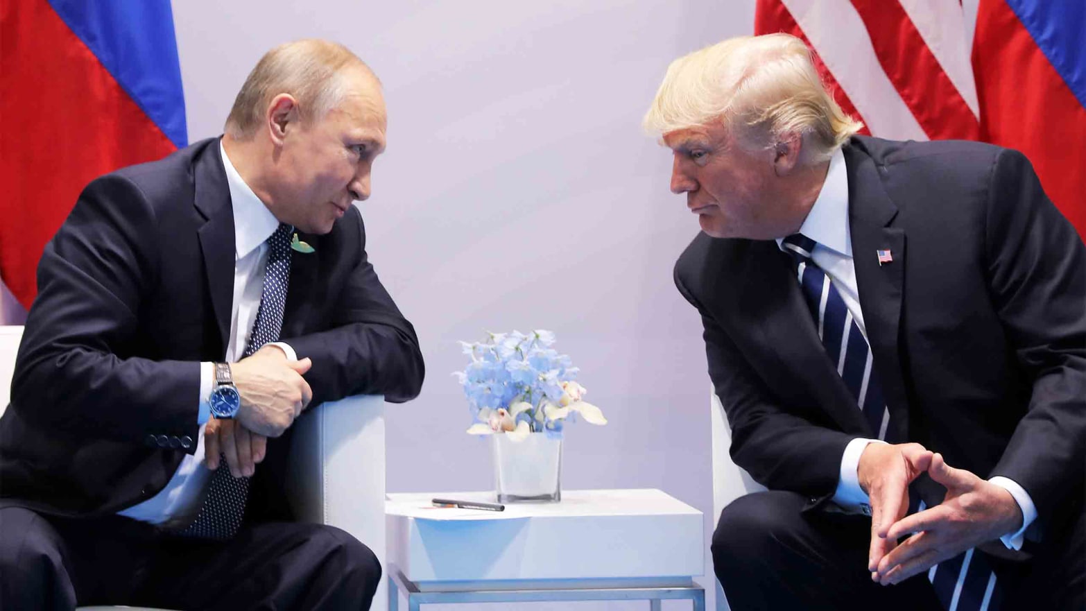 Russia's President Vladimir Putin talks to U.S. President Donald Trump during their bilateral meeting at the G20 summit in Hamburg, Germany July 7, 2017.    REUTERS/Carlos Barria - RC12A0EC47F0