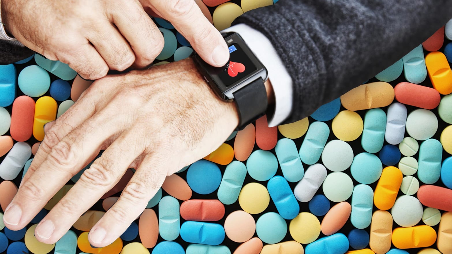 photo of hand with fitbit fit bit showing heart over tablets and pills john hancock insurance company west virginia life health fitness tracker