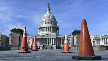Construction cones used to cover walkway flaws, stand along the sidewalk on Capitol Hill in Washington, Friday, Jan. 19, 2018.