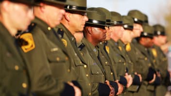 Border patrol agents listen to a graduation ceremony at the United States Border Patrol Academy in Artesia, New Mexico, June 9, 2017.