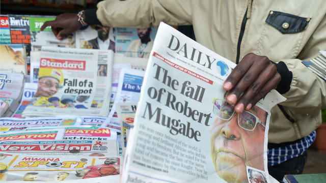 Image: a newspaper with an image of Mugabe on cover with headlines about the situation in Zimbabwe on November 16, 2017