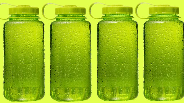 four green plastic bottles in a row on a lime background bpa water bottle fda safe