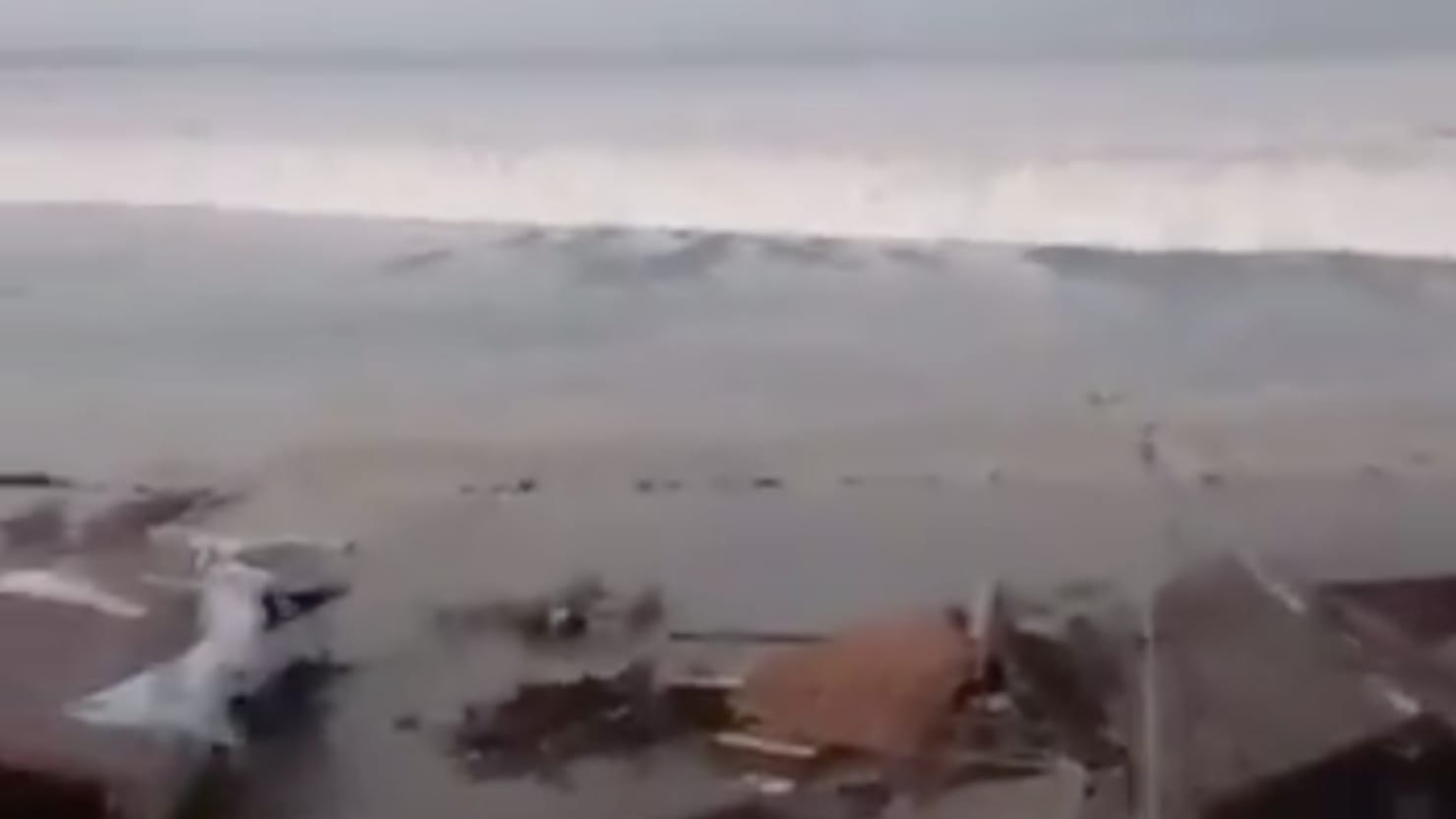 10-Foot Tsunami Destroys Homes on Indonesian Island image