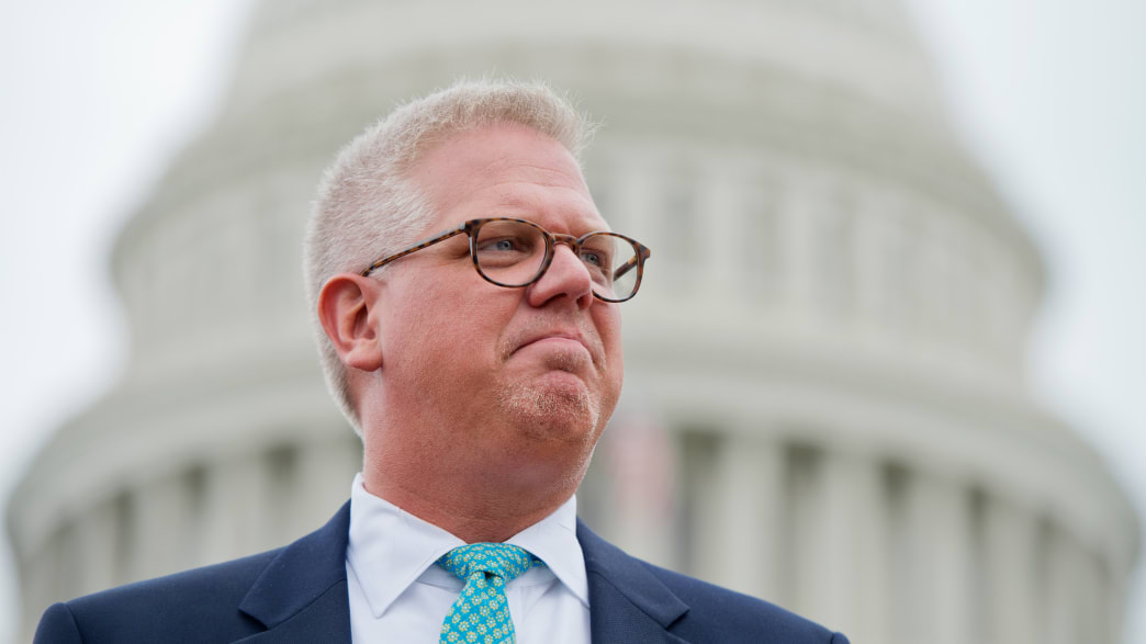 Conservative talk show host Glenn Beck attends a Tea Party Patriots rally on the west front of the Capitol to protest the IRS's targeting of conservative political groups.