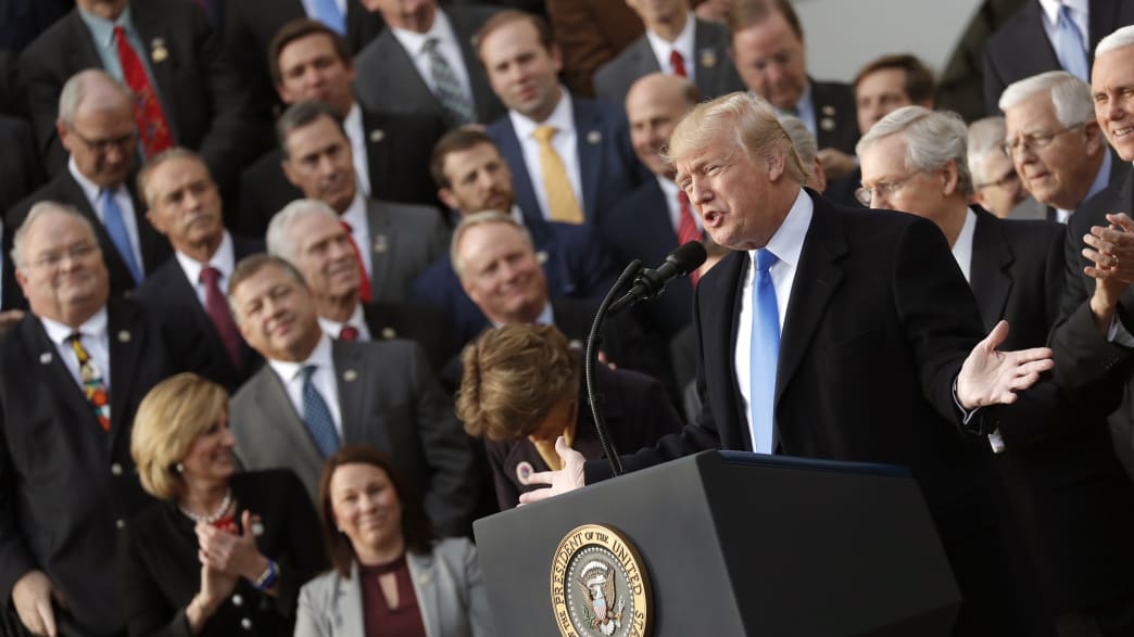 U.S. President Donald Trump celebrates with Congressional Republicans after the U.S. Congress passed sweeping tax overhaul legislation, on the South Lawn of the White House in Washington, U.S., December 20, 2017.