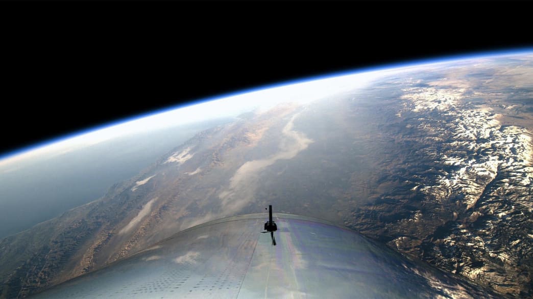 image of spaceshiptwo floating over earth virgin galactic richard branson space vacation elon musk big fucking rocket accident death