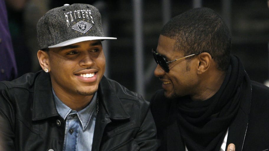 Recording artists Chris Brown (L) and Usher (R)