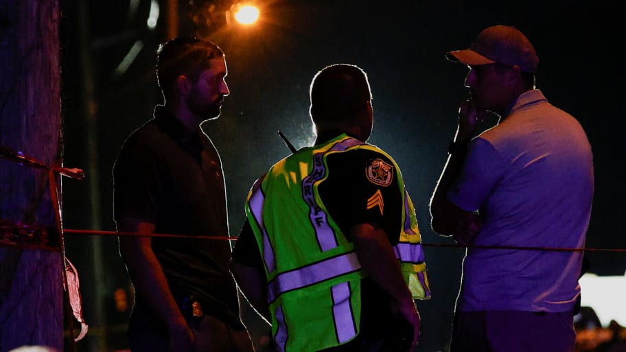 Law enforcement officers talk to each other as they work after reports of shots fired outside Donald Trump's golf club in West Palm Beach, Florida.